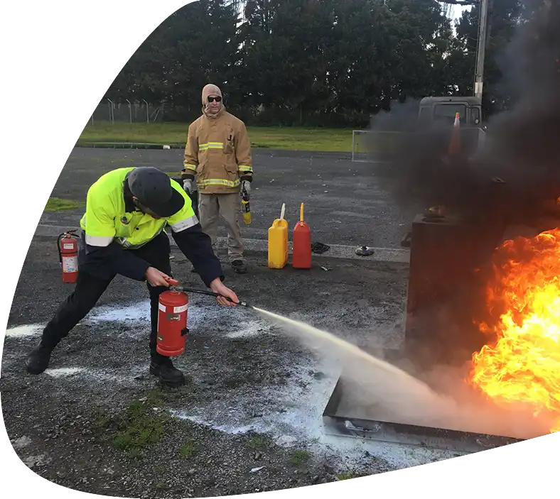 fire-warden-training-person-putting-out-fire